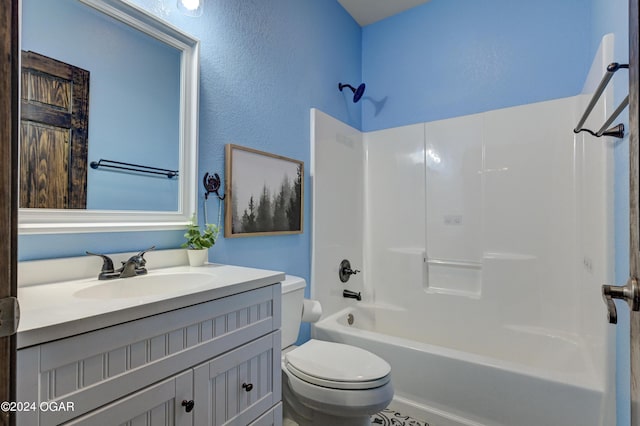 full bathroom with shower / washtub combination, vanity, and toilet