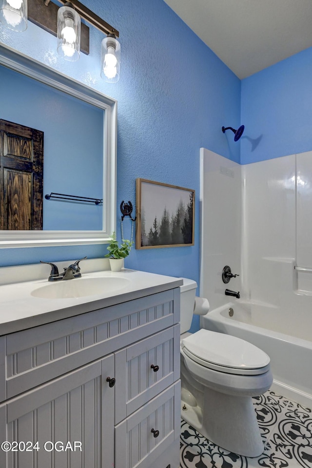 full bathroom featuring vanity, tile patterned flooring, toilet, and shower / washtub combination