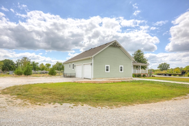 view of home's exterior with a yard and a porch