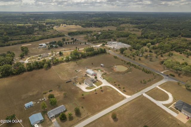 birds eye view of property with a rural view