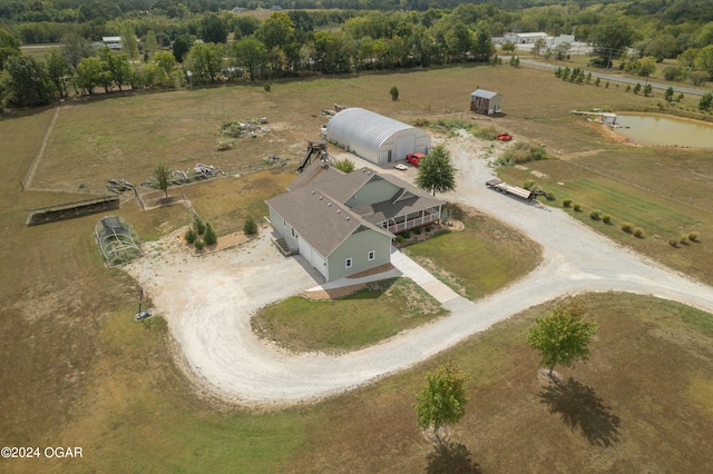 birds eye view of property with a rural view