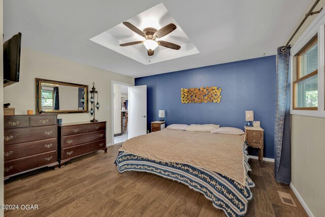 bedroom with wood-type flooring and ceiling fan