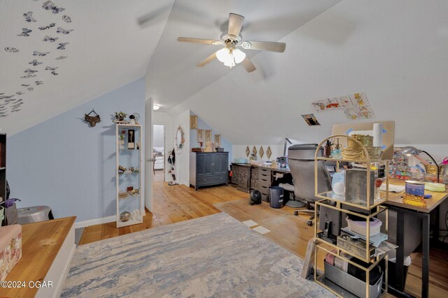 home office featuring light wood-type flooring, lofted ceiling, and ceiling fan