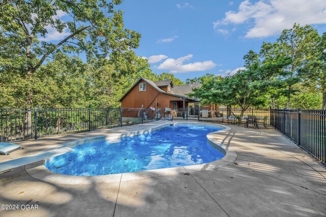 view of swimming pool featuring a patio