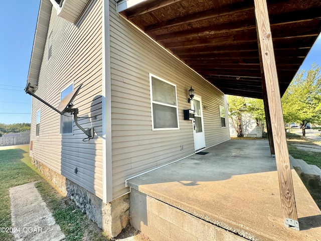 view of side of property featuring a patio area