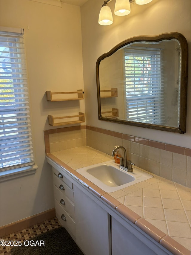 bathroom with tile patterned floors and vanity