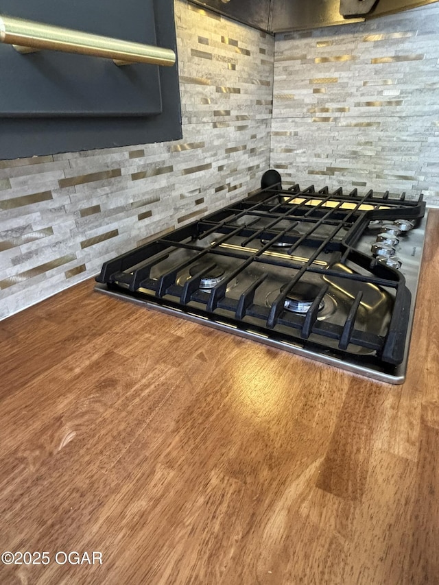 room details with gas stovetop and backsplash