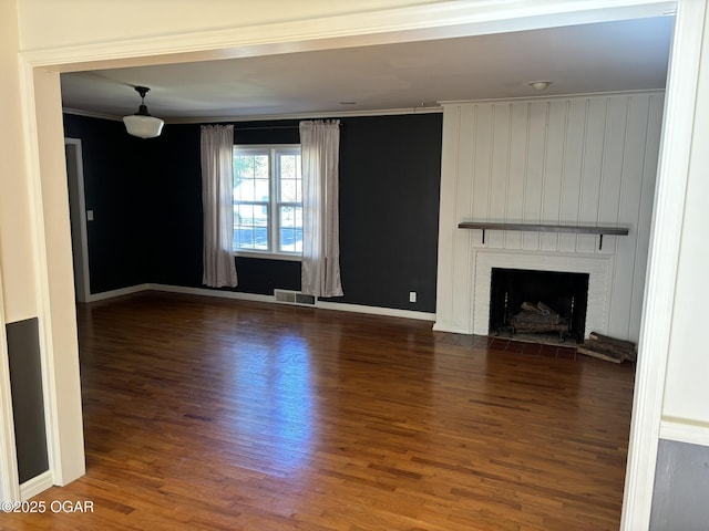 unfurnished living room featuring dark hardwood / wood-style flooring and a fireplace