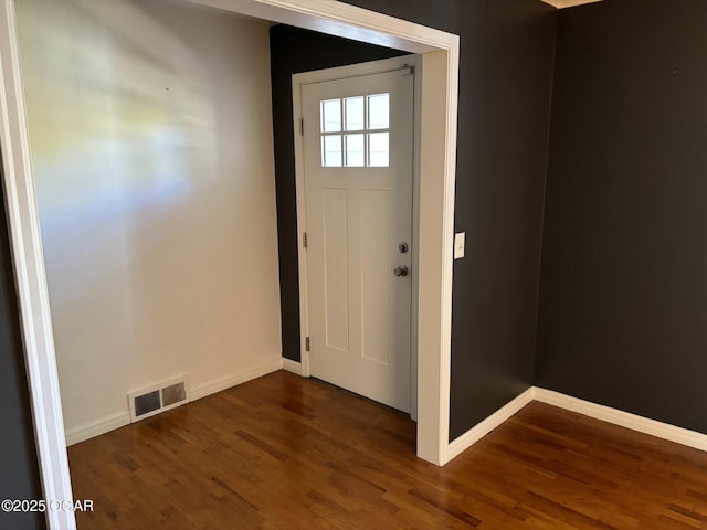 entrance foyer featuring dark wood-type flooring