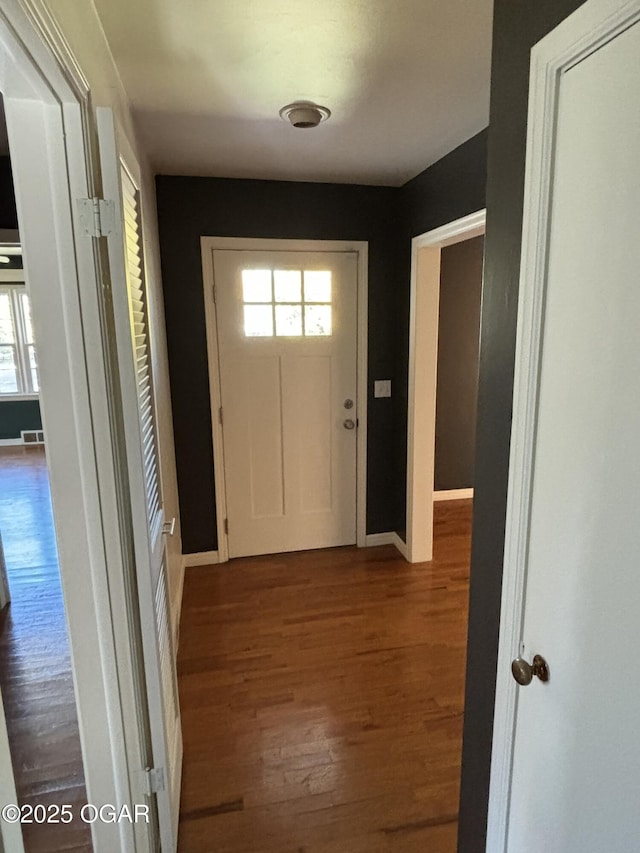 doorway with hardwood / wood-style floors