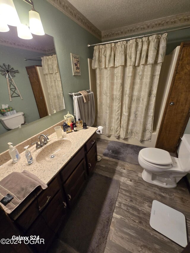 107 Foursome Ln, Carl Junction, MO 64834 - full bathroom with a textured ceiling, vanity, wood finished floors, and shower / tub combo with curtain