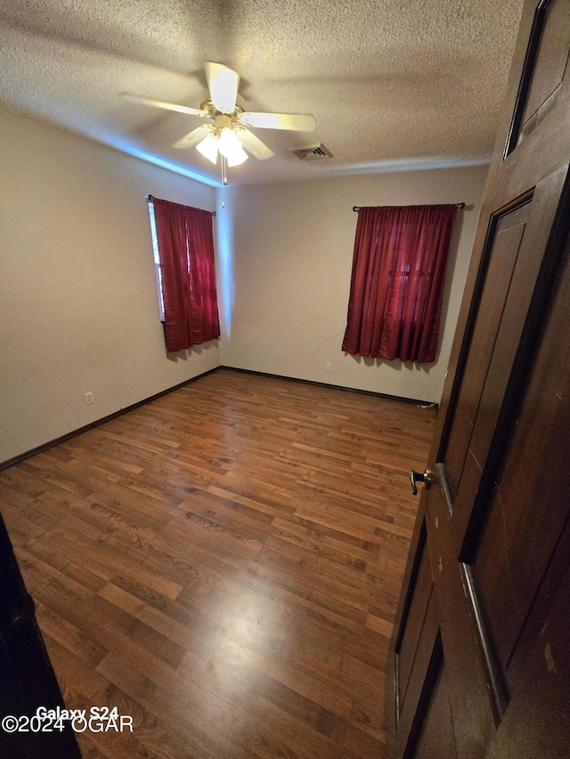 107 Foursome Ln, Carl Junction, MO 64834 - spare room featuring a ceiling fan, a textured ceiling, and wood finished floors