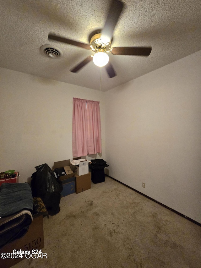 107 Foursome Ln, Carl Junction, MO 64834 - unfurnished bedroom with carpet flooring, a textured ceiling, and a ceiling fan