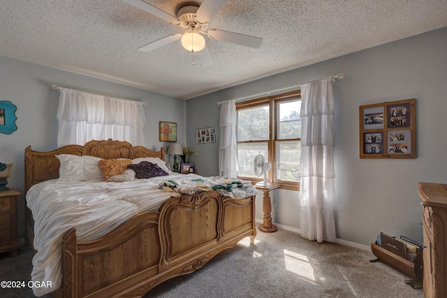 carpeted bedroom featuring ceiling fan and a textured ceiling