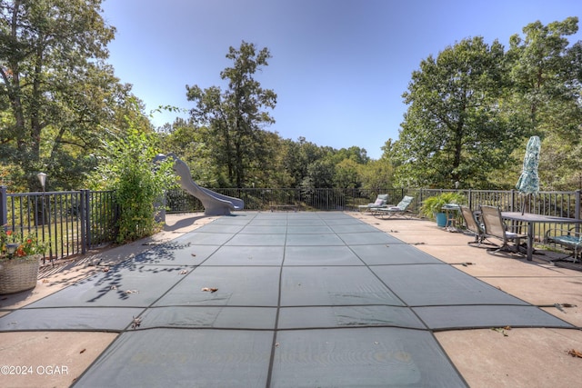 view of swimming pool featuring a patio