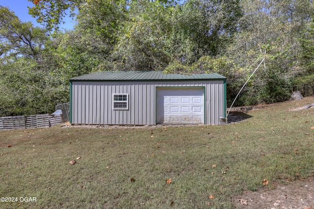 garage featuring a yard