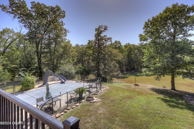 view of yard with a covered pool and a patio