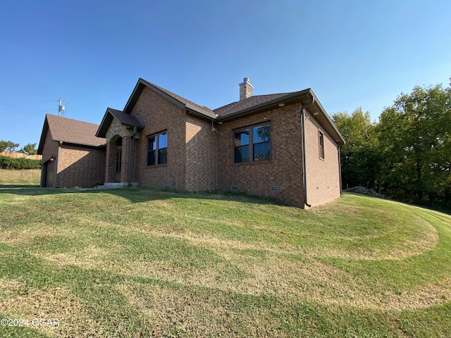 view of property exterior featuring a lawn