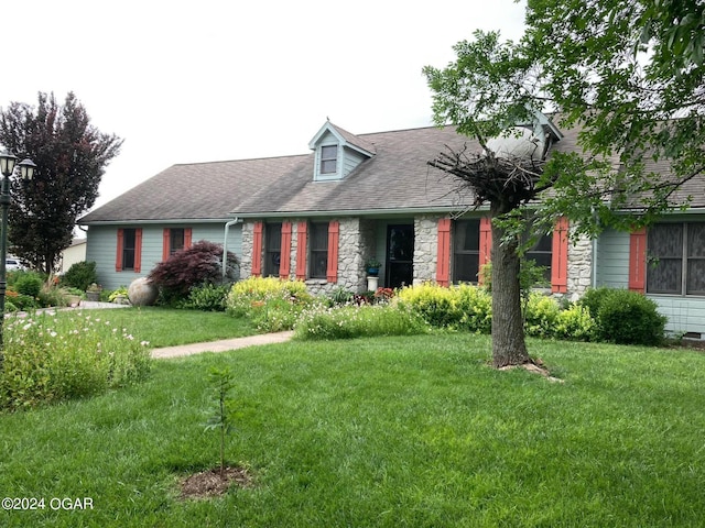 cape cod-style house with a front lawn