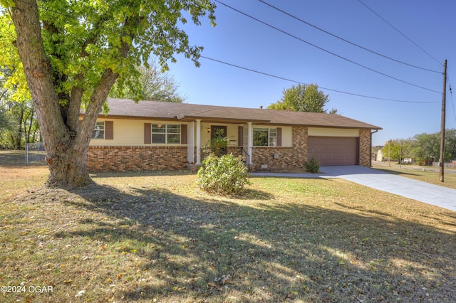 ranch-style house with a front yard and a garage