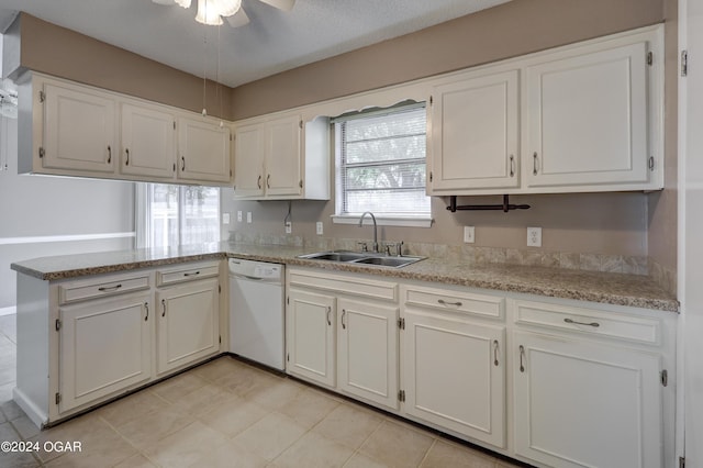 kitchen featuring white cabinetry, dishwasher, and sink