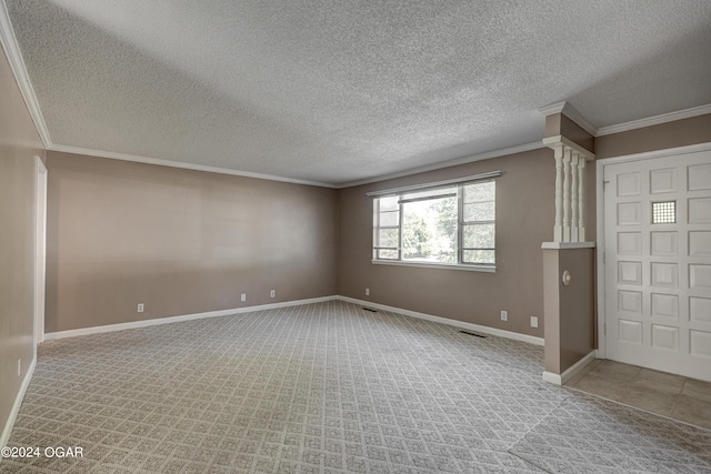 carpeted empty room featuring a textured ceiling and ornamental molding