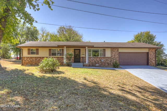 ranch-style house with a front yard and a garage