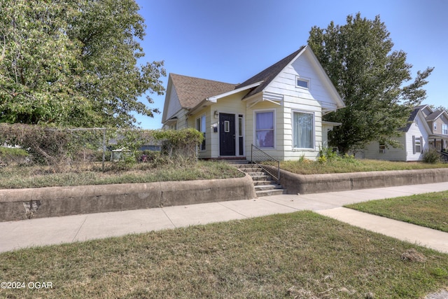 bungalow with a front lawn