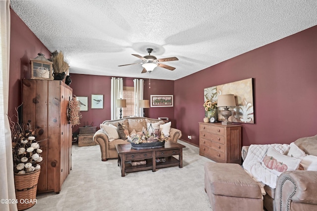 carpeted living room featuring ceiling fan and a textured ceiling