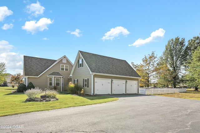 view of front property featuring a front yard and a garage