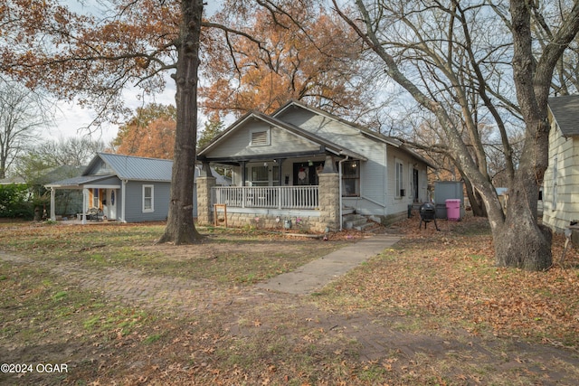 bungalow-style house featuring covered porch