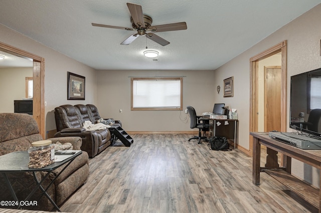 office with wood-type flooring, a textured ceiling, and ceiling fan