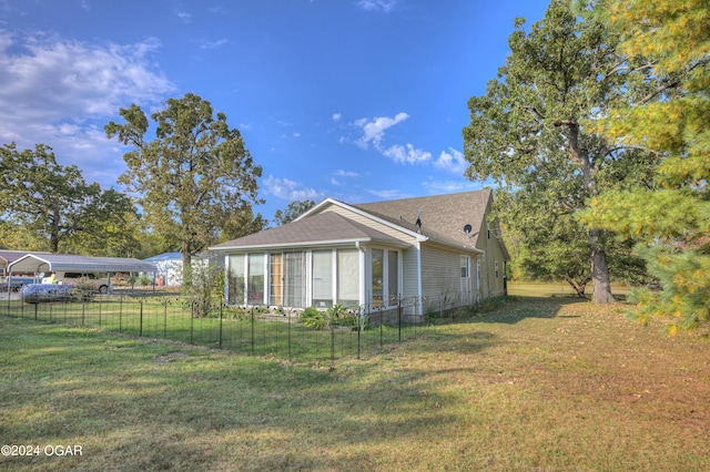 back of property featuring a lawn