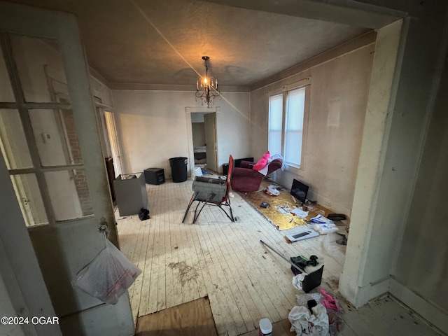 misc room featuring hardwood / wood-style flooring and a chandelier