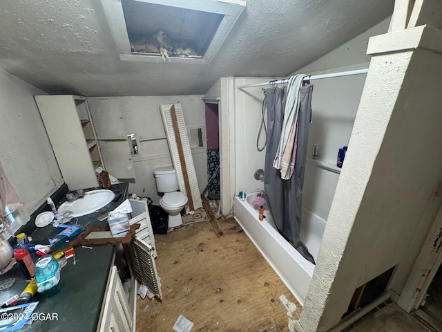 full bathroom with toilet, lofted ceiling, shower / bath combo with shower curtain, and vanity