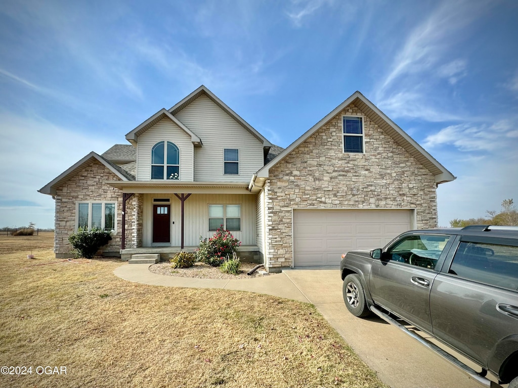 front facade featuring a front yard and a porch