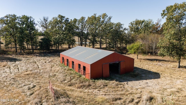 view of outbuilding featuring a rural view