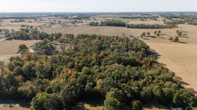 birds eye view of property featuring a rural view