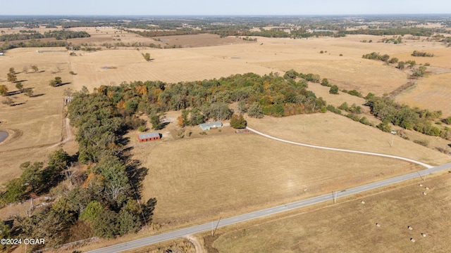 birds eye view of property featuring a rural view