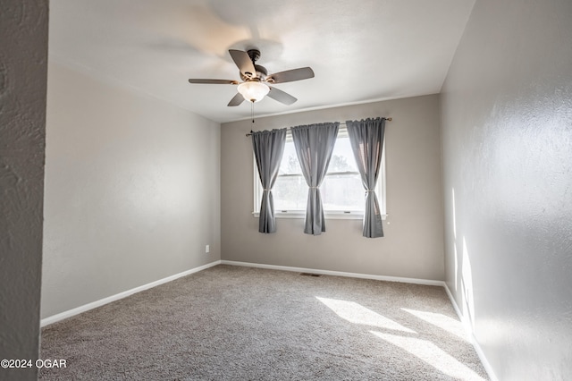 carpeted empty room with ceiling fan