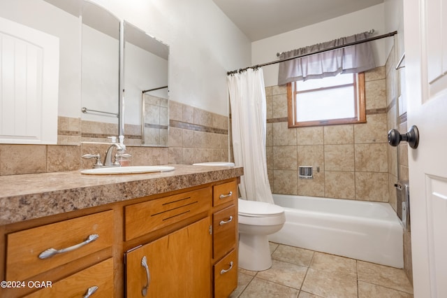 full bathroom featuring tile walls, toilet, shower / bath combo, vanity, and tile patterned floors