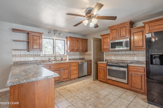 kitchen featuring backsplash, stainless steel appliances, sink, and light tile patterned floors