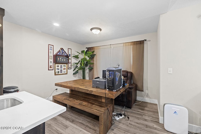 office space with light hardwood / wood-style flooring