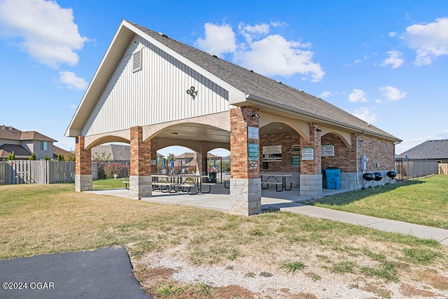 surrounding community featuring a yard and a patio