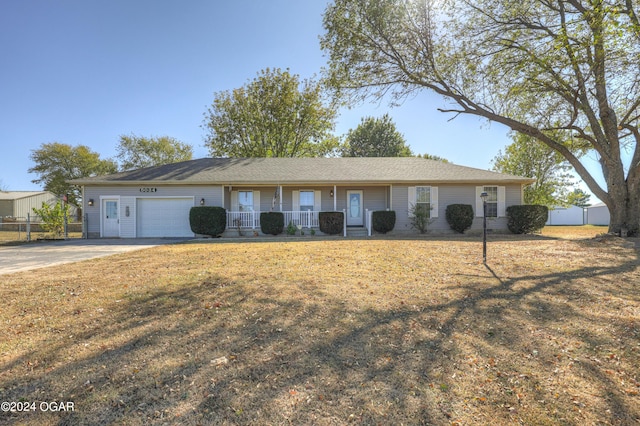 single story home with a front yard and a garage