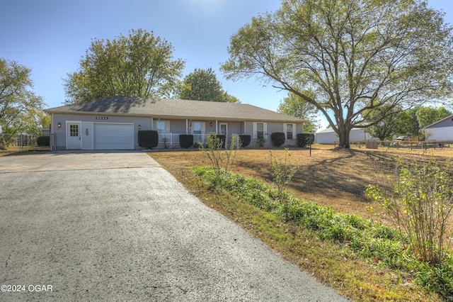 ranch-style house featuring a garage