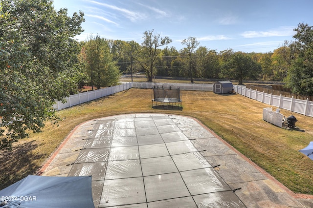 view of patio / terrace featuring a shed