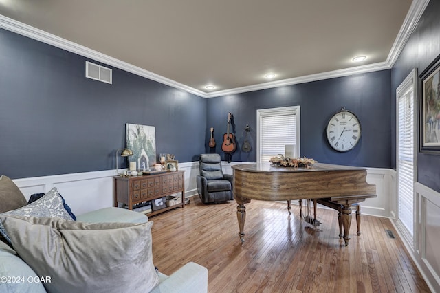 office space with crown molding and hardwood / wood-style floors