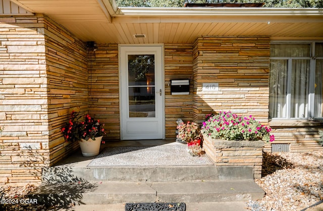 410 N Eisenhower St, Monett, MO 65708 - entrance to property featuring stone siding