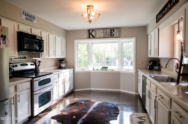 2652 S Farm Rd 51, Republic, MO 65738 - kitchen featuring appliances with stainless steel finishes, light countertops, dark wood finished floors, and a chandelier